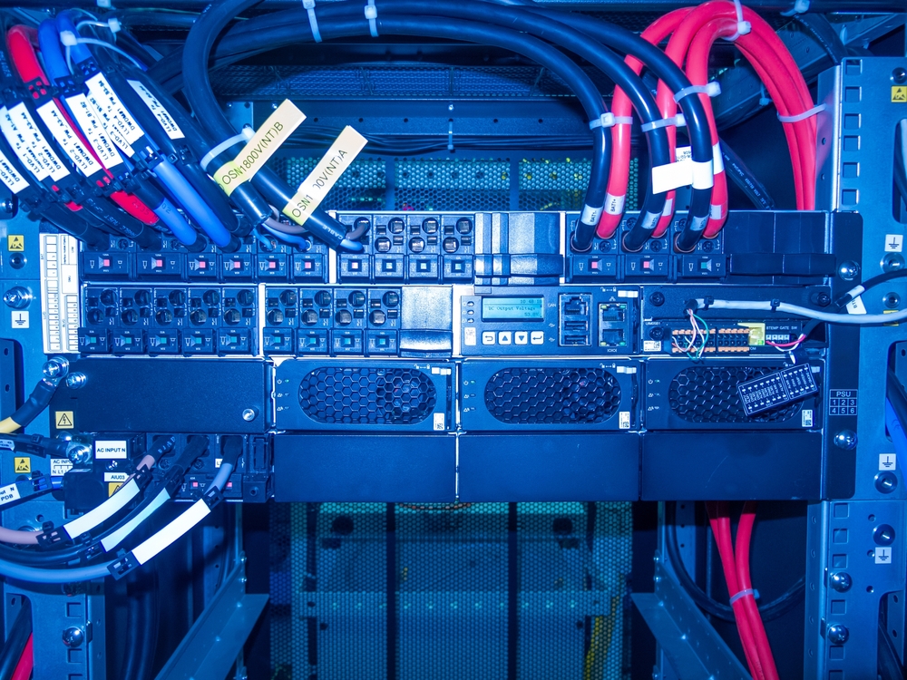 Detailed,view,of,a,server,rack,showcasing,colorful,cables,and